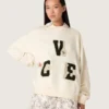 Bawełniana bluza unisex „Star” w kolorze vintage white z haftowanymi naszywkami VCE