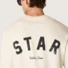 Bawełniana koszulka unisex „Star” w kolorze vintage white z czarnym nadrukiem na plecach