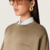 Bluza unisex z bawełny w kolorze wojskowej zieleni o wyglądzie wybielonym, z haftowanym logo