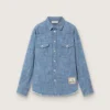 Koszulka unisex Journey z jasnoniebieskiej bawełny typu chambray z frędzlowym wykończeniem i haftowaną naszywką