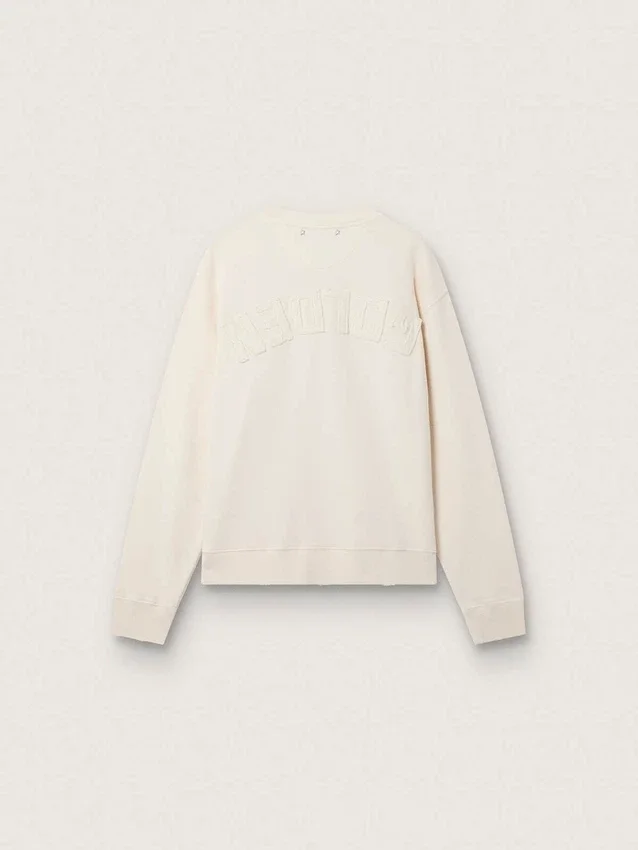 Kremowa bluza LTD z haftowaną naszywką