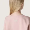Krótka bluza dziewczynkowa „Star” z różowej bawełny z naszywką i logo