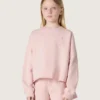 Krótka bluza dziewczynkowa „Star” z różowej bawełny z naszywką i logo