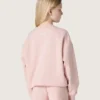 Krótka bluza dziewczynkowa „Star” z różowej bawełny z naszywką i logo