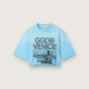 Krótka damska koszulka z jasnoniebieskiego dżerseju bawełnianego z nadrukiem graficznym